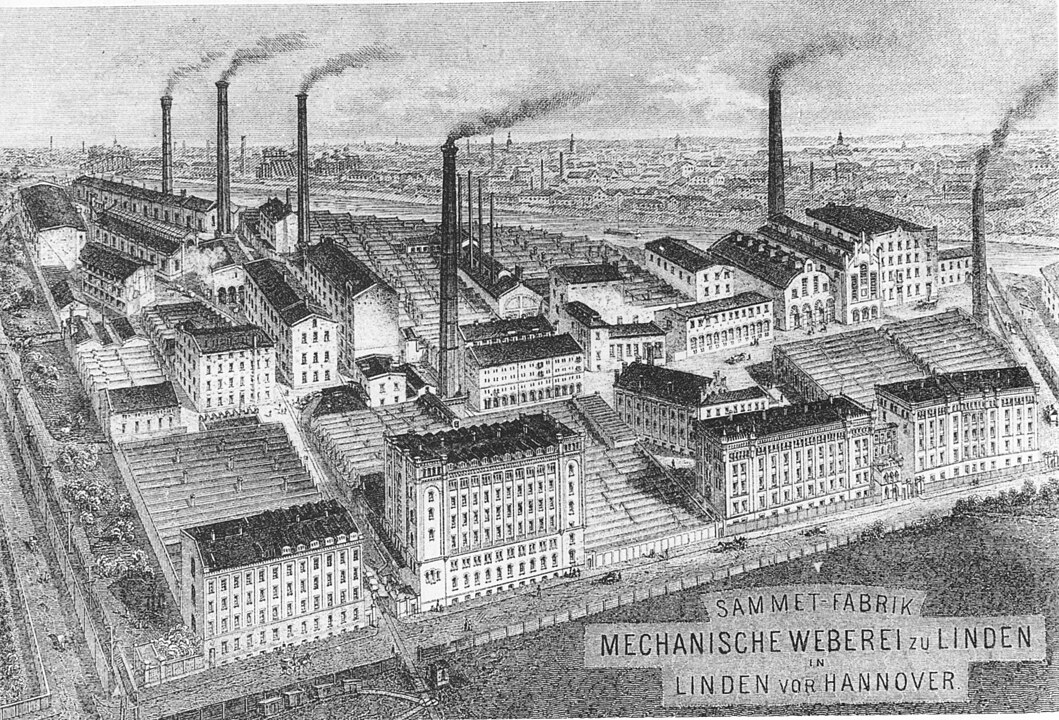 schwarz-weiß bild einer großen Fabrikanlage mit rauchenden Schornsteinen in Linden, heute Hannover